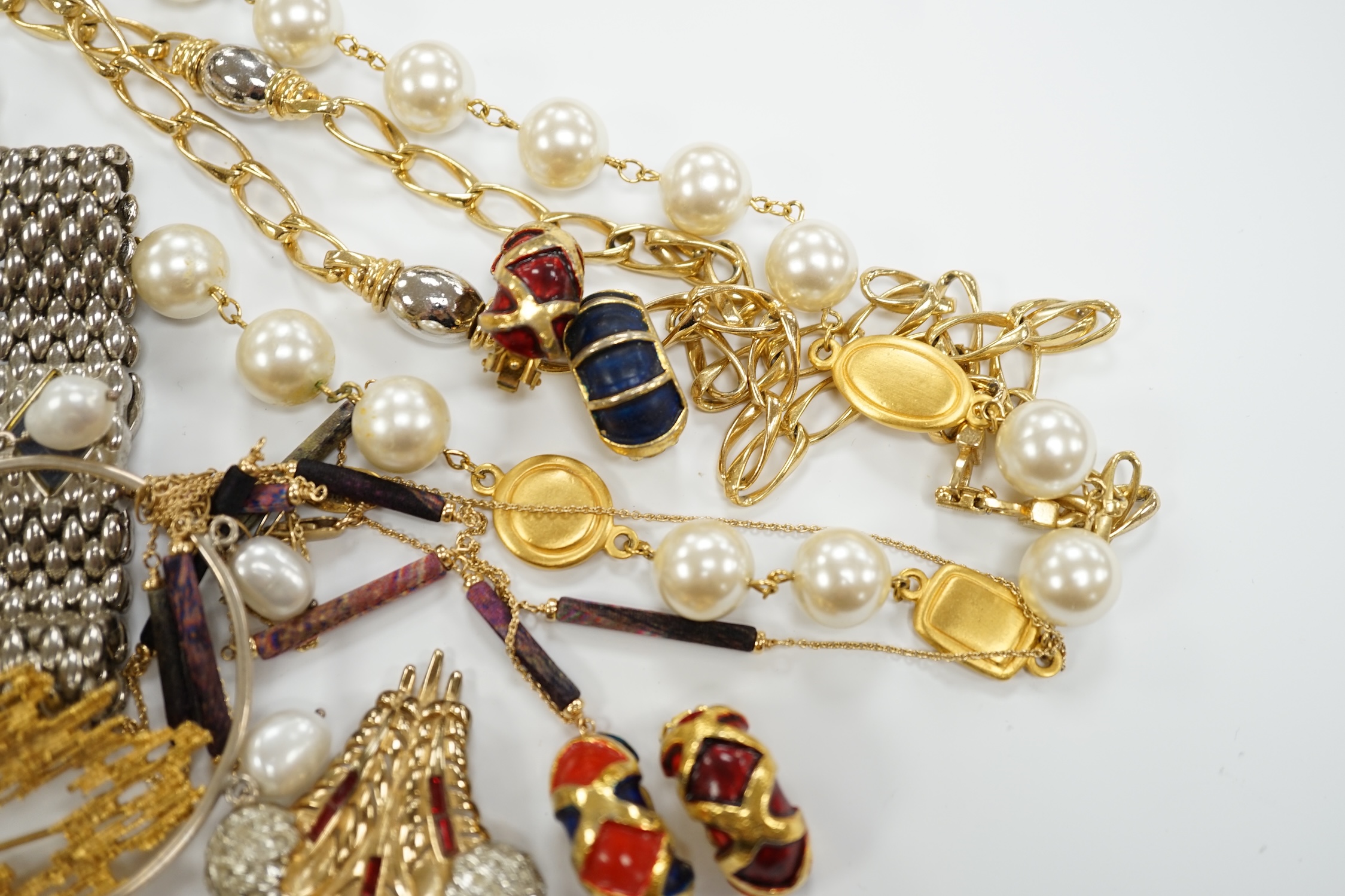 Two Christian Dior necklaces and three pairs of Dior ear clips, together with other signed pieces of costume jewellery.